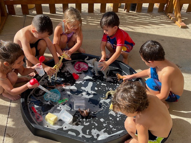 Children playing in an outdoor water activity